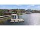 Aerial view of a lake with a swimming dock and other amenities along the community waterfront at 7582 Lyncrest St, North Port, FL 34287