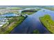 An aerial view of the neighborhood with a lake, showcasing the waterfront homesites at 763 Lakeside Dr, North Port, FL 34287