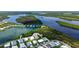 Aerial view of waterfront homes offering serene views with convenient access to a tranquil lake at 763 Lakeside Dr, North Port, FL 34287