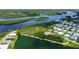 Aerial view of the home and the surrounding area, showcasing water features and neighborhood at 763 Lakeside Dr, North Port, FL 34287