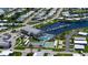 Aerial view of community amenities, including pool, clubhouse, shuffleboard courts, and boat docks at 763 Lakeside Dr, North Port, FL 34287