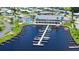 Aerial view of the community marina with boat slips and a clubhouse with a refreshing pool at 763 Lakeside Dr, North Port, FL 34287