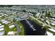 Aerial view of the community showcases the waterfront and boat docks, pool, and other amenities at 763 Lakeside Dr, North Port, FL 34287