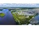 Aerial view of the home and the surrounding area, showcasing water features and neighborhood at 763 Lakeside Dr, North Port, FL 34287