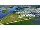Aerial view of the home and the surrounding area, showcasing water features and neighborhood at 763 Lakeside Dr, North Port, FL 34287