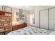 Bedroom featuring a ceiling fan, a bookshelf, a dresser, and a closet at 763 Lakeside Dr, North Port, FL 34287