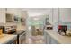 Bright dining area with natural light, stylish furniture, and easy access to the kitchen at 763 Lakeside Dr, North Port, FL 34287