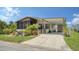 Charming single-story home with a covered carport and inviting screened-in porch at 763 Lakeside Dr, North Port, FL 34287