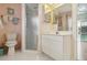 Bathroom features glass shower, tiled floors, and view into other rooms at 1110 Southlake Ct, Venice, FL 34285