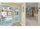 View of the breakfast nook with sliding door access to the screened-in pool and the kitchen at 1110 Southlake Ct, Venice, FL 34285