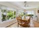 Inviting dining area with lush green garden views, enhancing the dining experience with a touch of nature at 1110 Southlake Ct, Venice, FL 34285