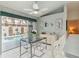 Cozy dining area with a view of the pool area through sliding glass doors, perfect for indoor/outdoor living at 1110 Southlake Ct, Venice, FL 34285