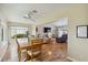 Open dining area with abundant natural light, seamlessly connecting to the living room, ideal for Gathering meals at 1110 Southlake Ct, Venice, FL 34285