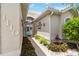 Inviting walkway leading to the front door, surrounded by lush landscaping at 1110 Southlake Ct, Venice, FL 34285