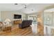 Bright living room with sliding glass doors leading to a pool area, creating a seamless indoor-outdoor living experience at 1110 Southlake Ct, Venice, FL 34285