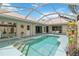 Private screened-in pool with ample deck space, tiled patio, and inviting atmosphere at 1110 Southlake Ct, Venice, FL 34285