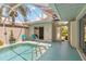 Outdoor pool area with screened enclosure, comfortable seating, and a well-maintained patio for relaxation at 1110 Southlake Ct, Venice, FL 34285