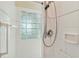 Close-up of the shower area, featuring glass block window at 1110 Southlake Ct, Venice, FL 34285