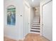 Hallway features tile floors, stairway to second floor, with access to multiple rooms at 1164 Beachcomber Ct # 19, Osprey, FL 34229