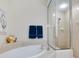 Bathroom featuring a luxurious soaking tub and frameless shower for a spa-like experience at 1164 Beachcomber Ct # 19, Osprey, FL 34229
