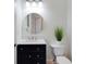 Classic powder room featuring a vanity with marble counters, stylish lighting, and classic fixtures at 1164 Beachcomber Ct # 19, Osprey, FL 34229