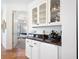 Wet bar with a view into a bedroom through an open doorway at 1164 Beachcomber Ct # 19, Osprey, FL 34229