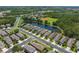 Aerial view of homes, a pond and recreation area at 11954 Tempest Harbor Loop, Venice, FL 34292