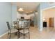 Eat in kitchen with white cabinets, stainless appliances, and a dining area at 11954 Tempest Harbor Loop, Venice, FL 34292