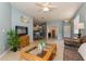 Open-concept living space with tile floors, kitchen view, and access to other rooms at 11954 Tempest Harbor Loop, Venice, FL 34292