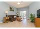 Inviting living room showcasing tile floors, neutral walls and access to the outdoors at 11954 Tempest Harbor Loop, Venice, FL 34292