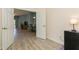 Living space with an open doorway and tile floors leading to the dining area at 11954 Tempest Harbor Loop, Venice, FL 34292
