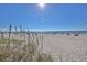 Scenic beach view with sandy dunes and gentle waves, ideal for a relaxing coastal escape at 120 Hourglass Dr, Venice, FL 34293