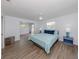 Spacious bedroom featuring modern flooring, ample natural light, and serene décor at 120 Hourglass Dr, Venice, FL 34293