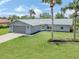 Charming single-story home with a two-car garage, well-manicured lawn, and tasteful landscaping at 120 Hourglass Dr, Venice, FL 34293