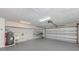 Spacious garage featuring epoxy flooring, utility sink and laundry hook-ups at 120 Hourglass Dr, Venice, FL 34293