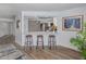 Inviting kitchen bar with seating, open to the adjacent living spaces at 120 Hourglass Dr, Venice, FL 34293