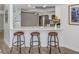 Stylish kitchen bar with seating, perfect for casual dining and entertaining at 120 Hourglass Dr, Venice, FL 34293