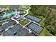 Community features tennis courts, pool, and clubhouse with lush landscaping and inviting atmosphere at 12140 Wellen Golf St # 202, Venice, FL 34293