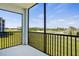 Screened balcony offering panoramic golf course views, perfect for relaxing outdoors at 12140 Wellen Golf St # 202, Venice, FL 34293
