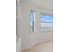 Bedroom featuring windows with views of a lake at 12140 Wellen Golf St # 202, Venice, FL 34293