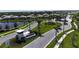 Aerial view of the Wellen Park entrance sign, welcoming visitors with manicured landscaping and a serene lake backdrop at 12140 Wellen Golf St # 202, Venice, FL 34293