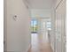 Condo entryway with tile flooring leading to the living area and view of the balcony at 12140 Wellen Golf St # 202, Venice, FL 34293