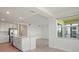 Bright kitchen with stainless steel appliances and a large island, open to the living space at 12140 Wellen Golf St # 202, Venice, FL 34293