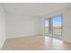 Living room featuring tiled floors and sliding doors at 12140 Wellen Golf St # 202, Venice, FL 34293