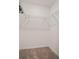 An organized walk-in closet featuring built-in white wire shelving for optimal storage space at 12140 Wellen Golf St # 202, Venice, FL 34293