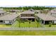 Spacious backyard featuring a well-maintained lawn, privacy fence, and three palm trees at 12617 Oak Hill Way, Parrish, FL 34219