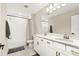 Bathroom features a double vanity, tile floors, and a shower-tub combination at 12617 Oak Hill Way, Parrish, FL 34219