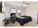 Cozy bedroom furnished with a modern desk, comfortable chair, and neutral decor at 12617 Oak Hill Way, Parrish, FL 34219