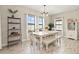 Cozy dining area with modern chandelier and furniture and decorative shelving at 12617 Oak Hill Way, Parrish, FL 34219