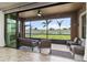 Screened lanai with comfortable seating and a beautiful view of the fenced backyard at 12617 Oak Hill Way, Parrish, FL 34219